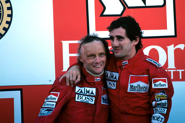 ALAIN PROST CONGRATULATES CHAMPION LAUDA ON THIS DAY IN 1984