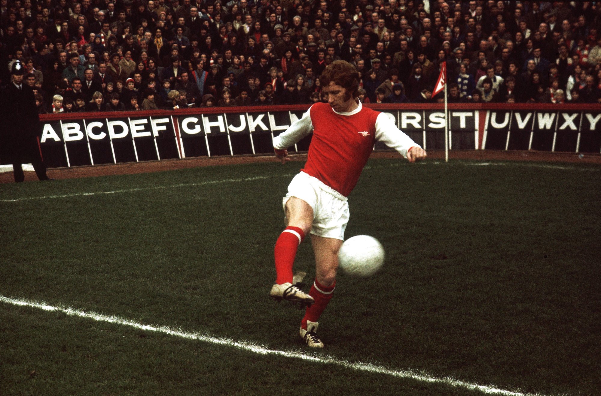  Alan Ball, a former professional footballer who played as a midfielder, is seen here playing for Arsenal against Manchester United.